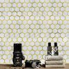 white hexagonal marble mosaic tile with golden metal frame